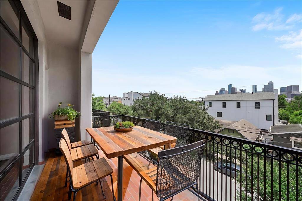 Front Patio accessible via the garage door and a side door in the Living Room - virtually staged