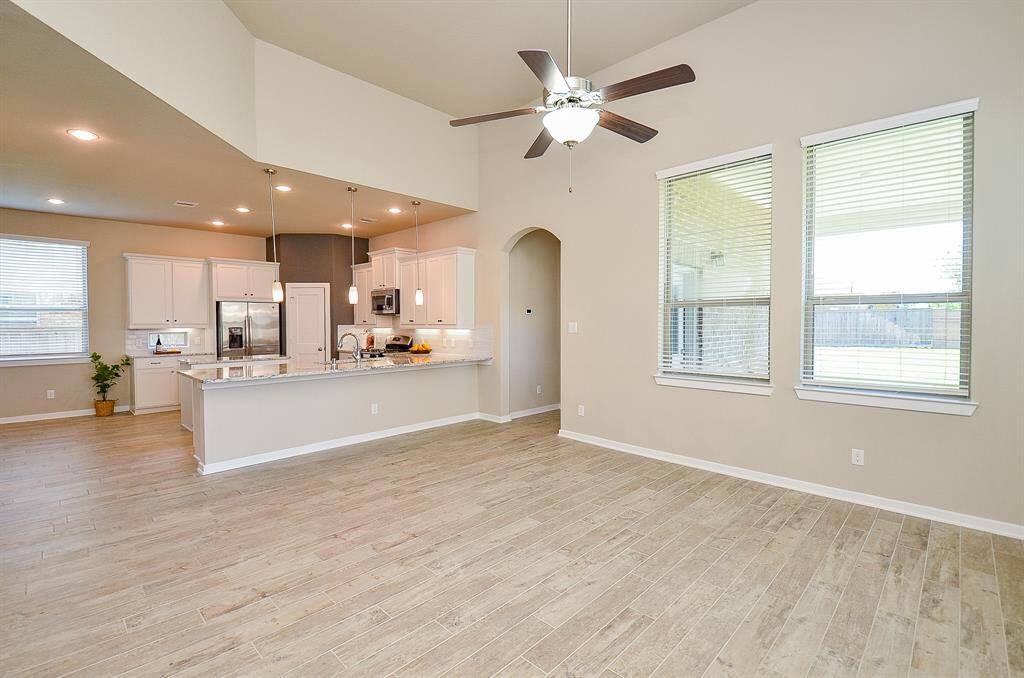 This space seamlessly connects to the kitchen and breakfast nook, creating an effortless flow.