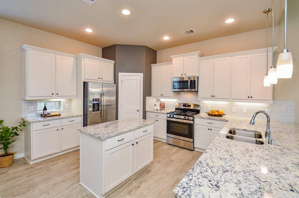 This space opens beautifully into the living and breakfast areas, making it perfect for entertaining or keeping an eye on things while you cook.