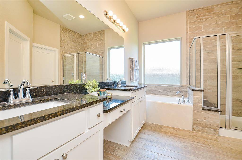 Enjoy a relaxing soak in the deep tub or refresh in the spacious walk-in shower—this space was made for unwinding.