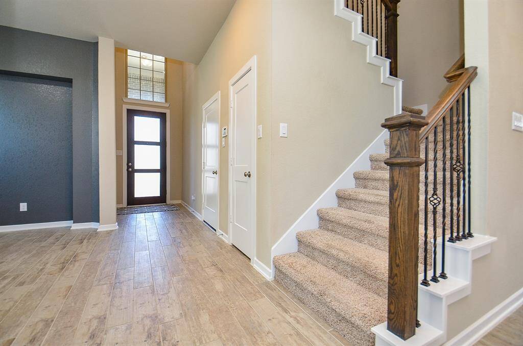 The staircase to your left adds an architectural focal point while leading to the upstairs living quarters.