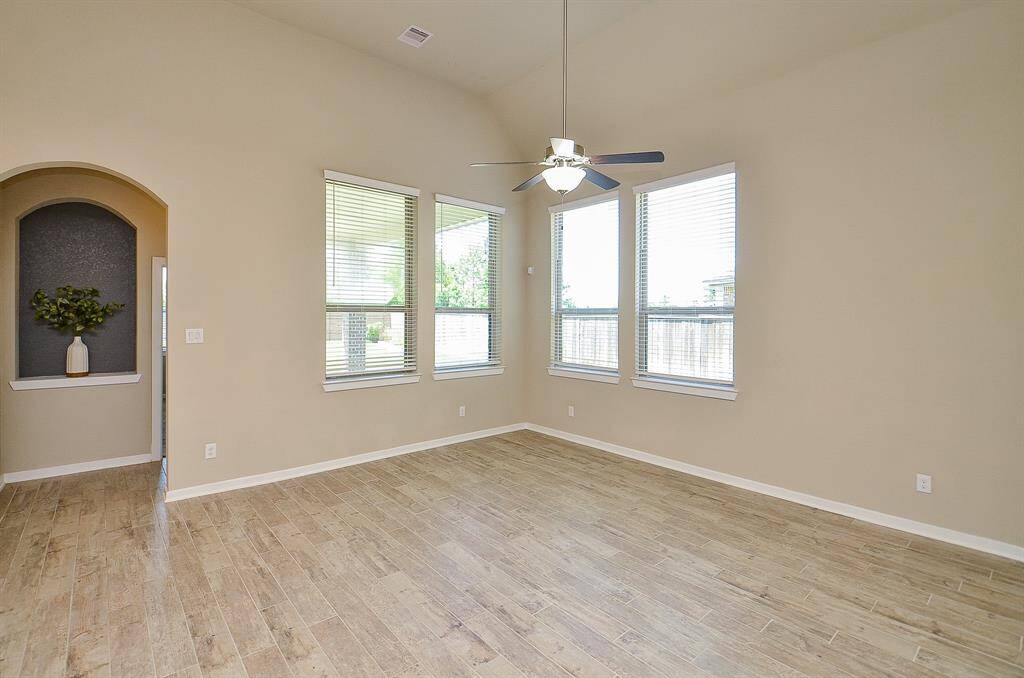Bright, open, and inviting, the living room offers plenty of space to relax or gather with friends and family.