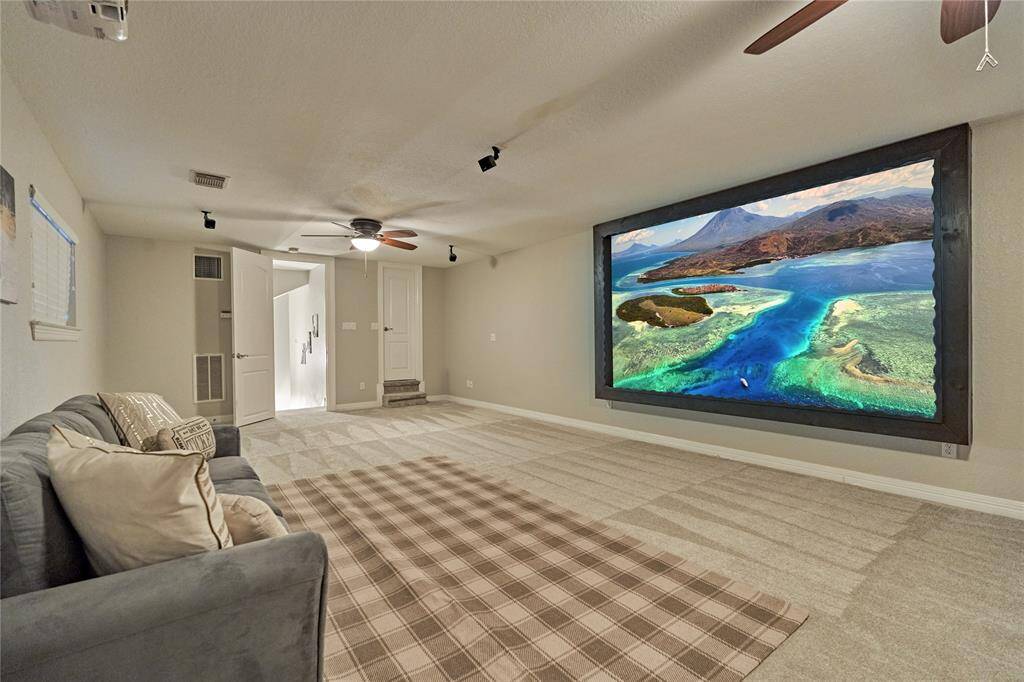 Seamless view of the backyard lounge area, framing the formal sitting space and breakfast nook