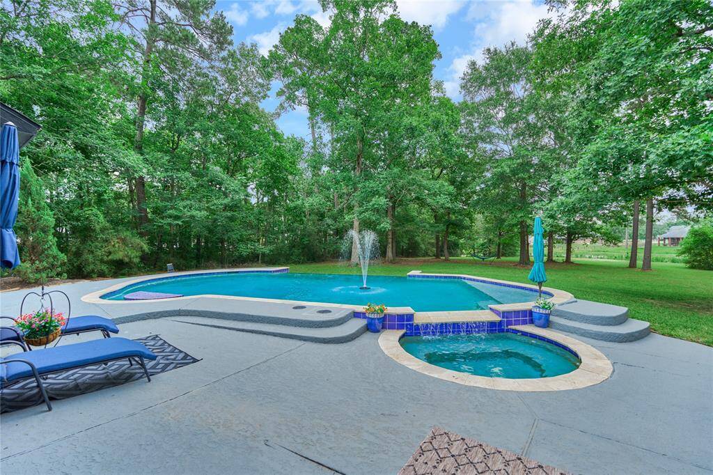 Gourmet kitchen with new cooktop, custom cabinetry, and premium stainless steel appliances