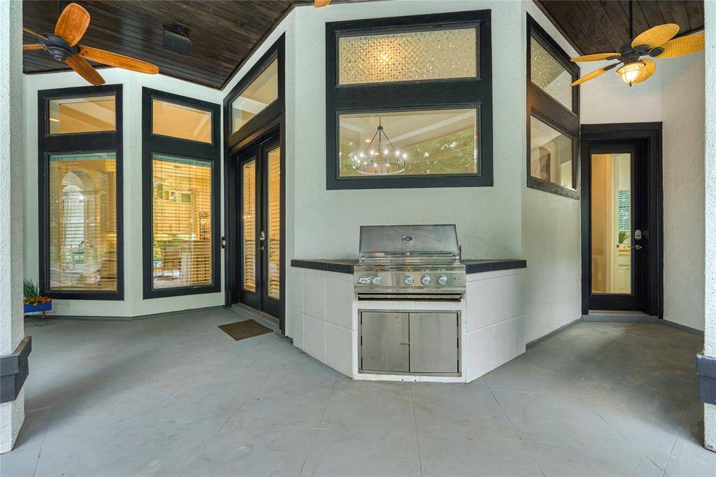 Hollywood inspired primary bath, with a spacious walk-in shower, a standalone soaking tub, and abundant natural light for the perfect blend of elegance and tranquility
