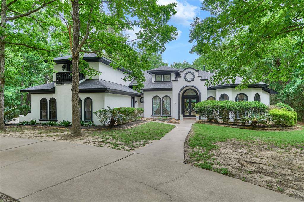Private driveway with charming bridge entrance.