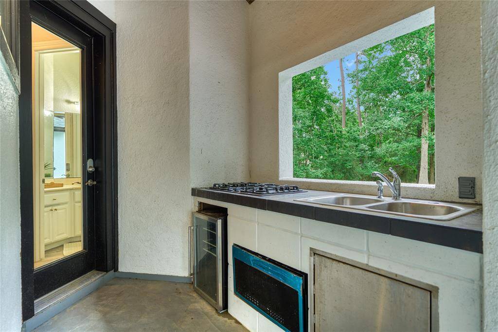 Hollywood inspired primary bath, with a spacious walk-in shower, a standalone soaking tub, and abundant natural light for the perfect blend of elegance and tranquility
