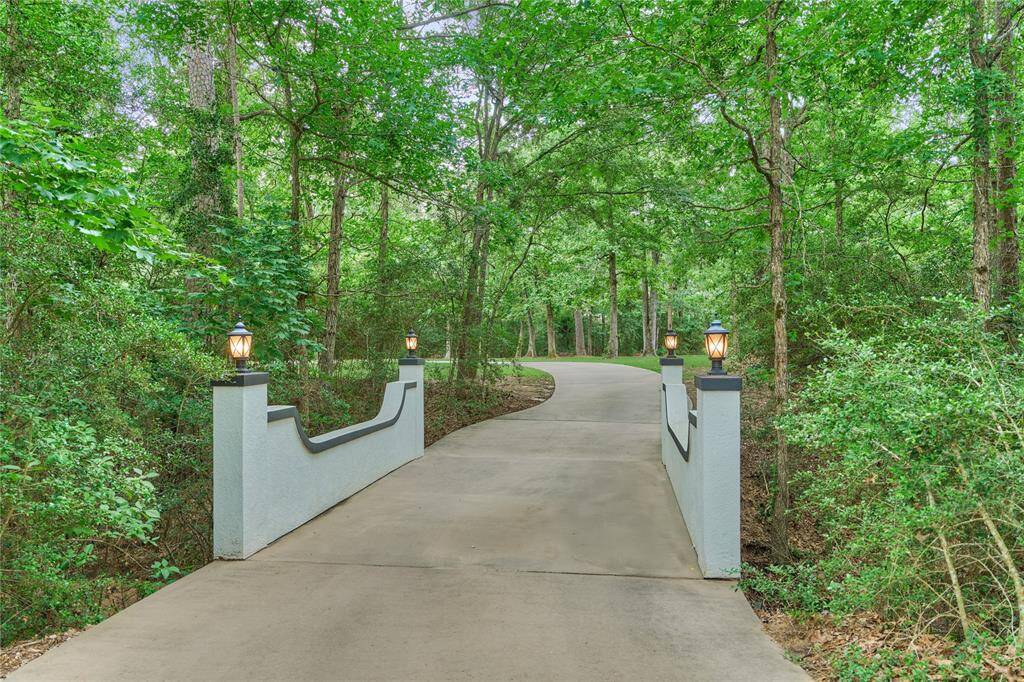 Exquisite grand entrance with custom doors, leading into a luxurious sitting room