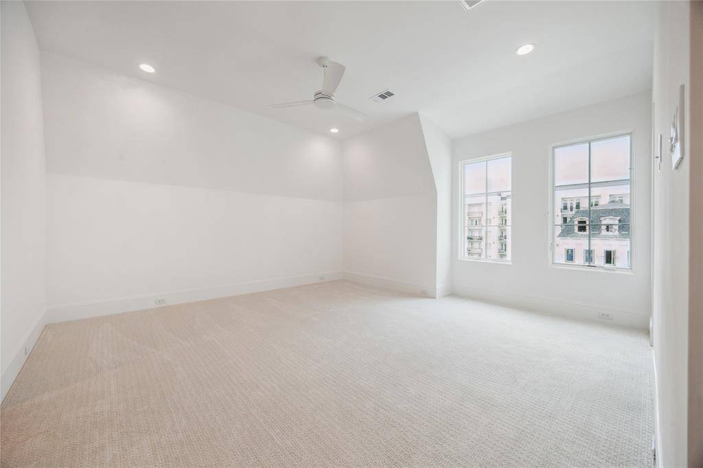 The third floor features this expansive bedroom with oversized walk-in closet and en-suite bathroom.