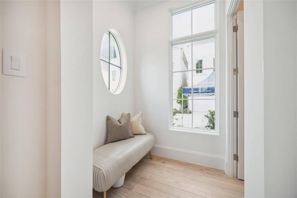 Directly off the entry is this landing area. This space is adorned with windows to allow for additional lighting to fill the foyer. The powder bath can be accessed from this space to allow for privacy.