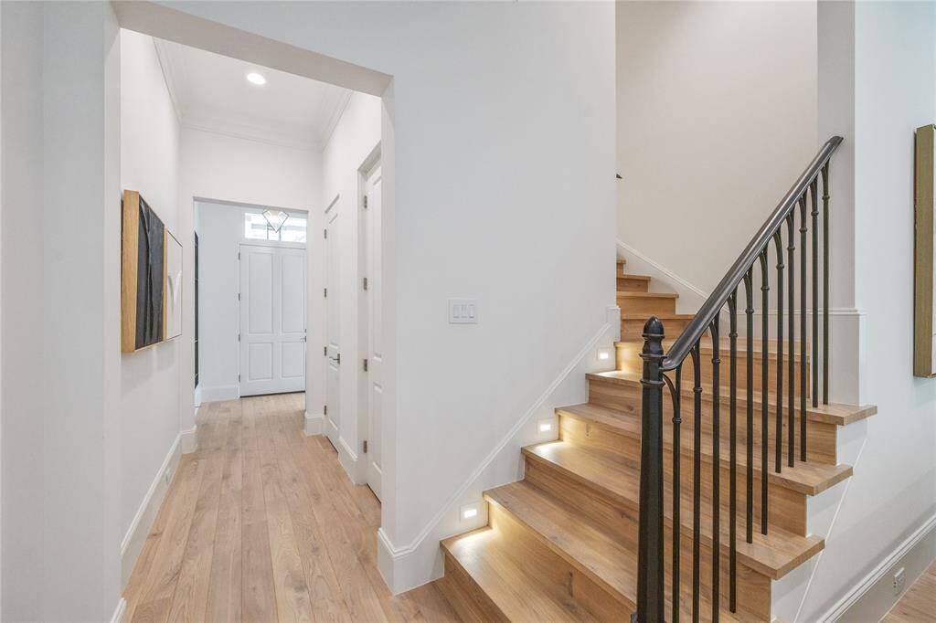 Along the entry hallway there is a dedicated coat closet, along with an elevator shaft that is currently a second large storage space.