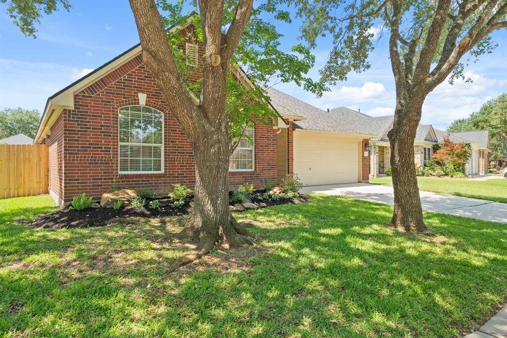 Meticulously landscaped in front & back.