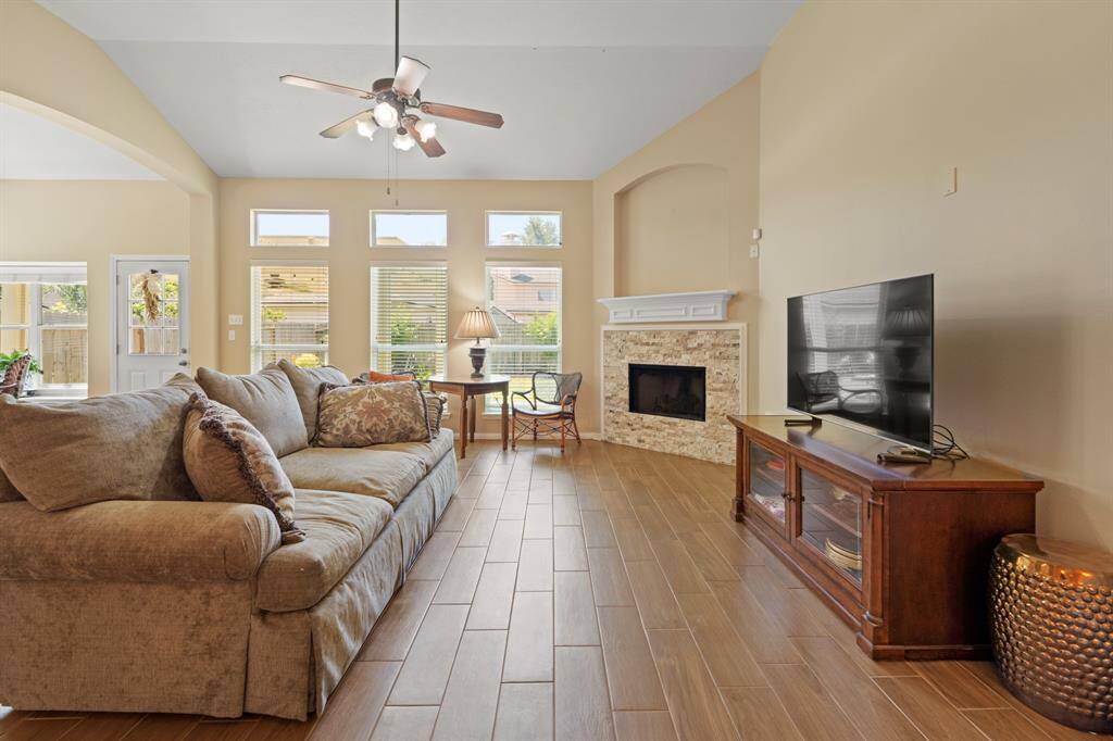 Open-concept layout with beautiful wood flooring.