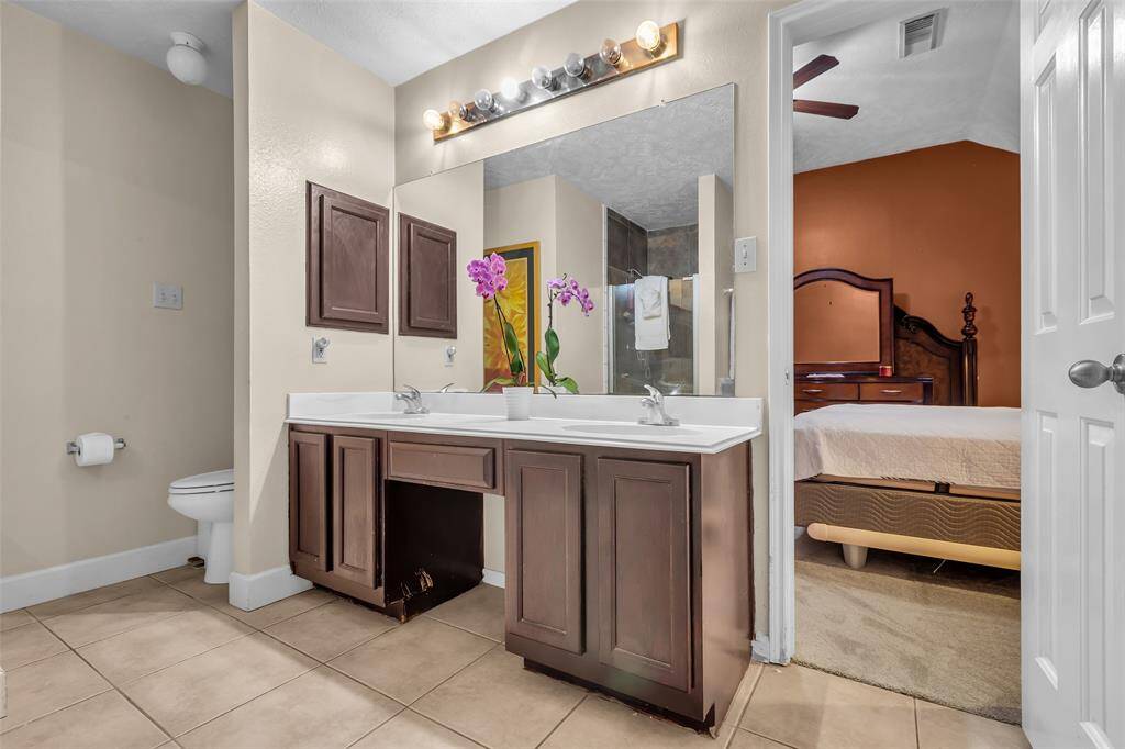Primary bathroom with double sinks, a garden tub and separate shower.