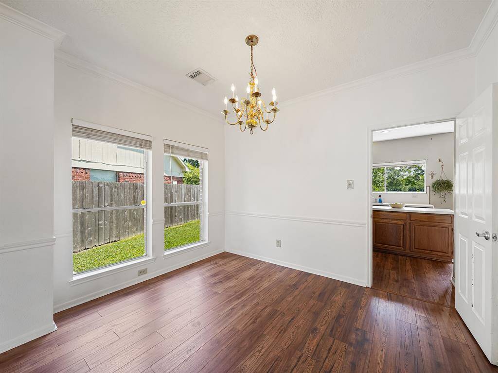 Home has great natural sunlight from all angles! Dining room table will fit perfectly here.