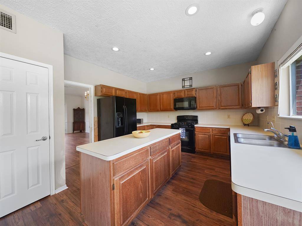Beautifully designed kitchen offers an abundance of cabinet space—perfect for keeping everything organized and within reach.