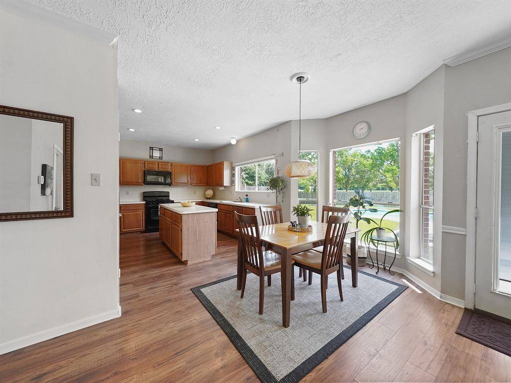 Alternate view from the living room into the breakfast and kitchen area.