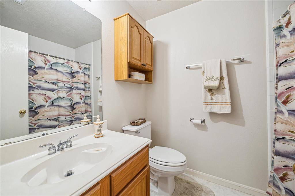 This full bathroom is conveniently located on the second floor, offering functionality and comfort for family or guests. Features include a shower/tub combo.