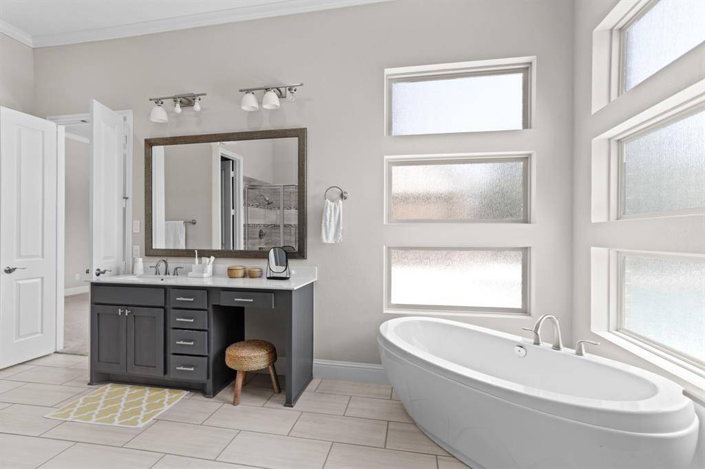 View of one of the double sinks with vanity area attached.