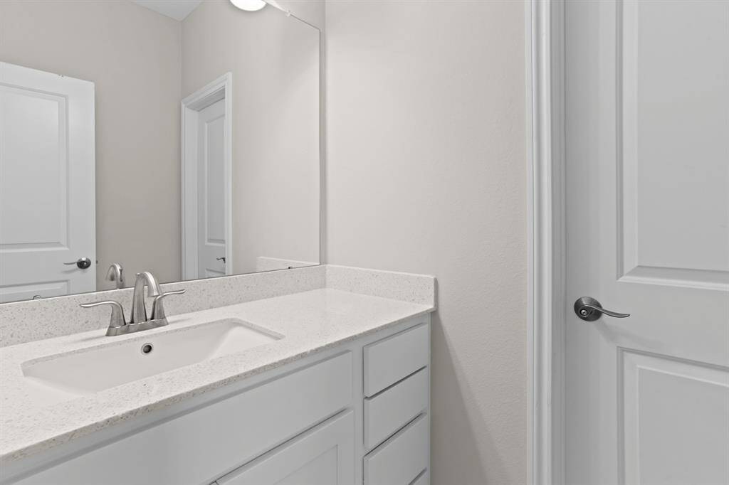 Secondary bathroom located upstairs.