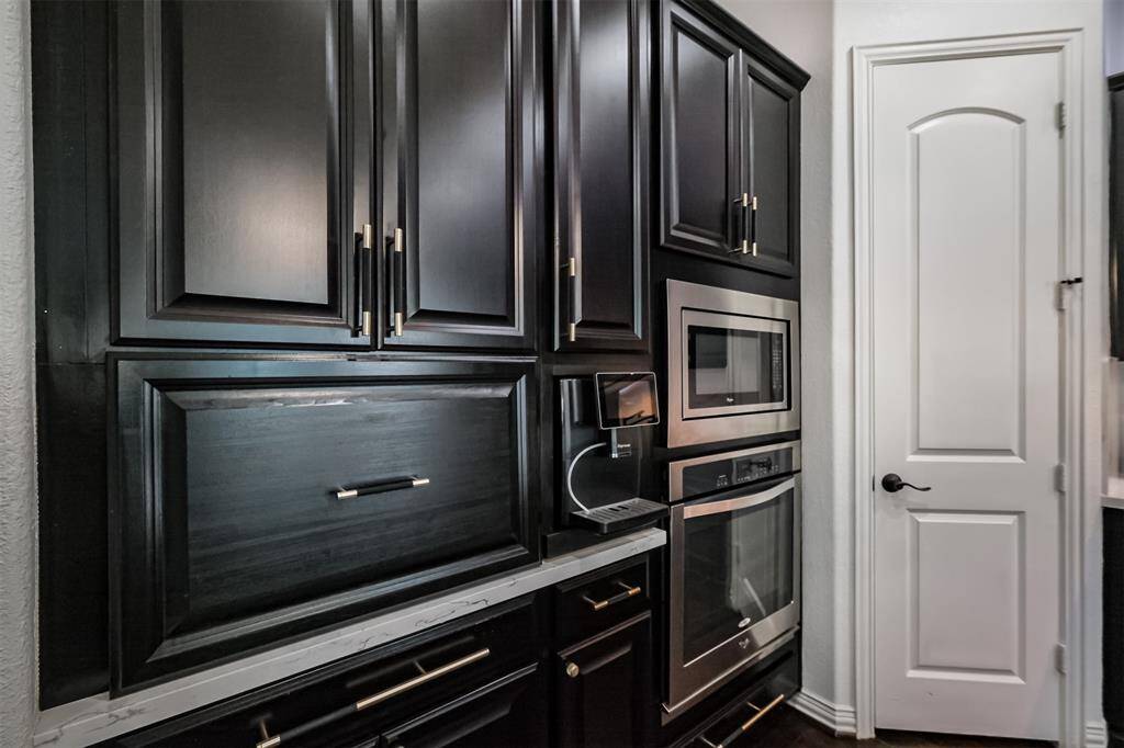 Built in espresso machine plus appliance "garage" are just two of the special features of this kitchen.