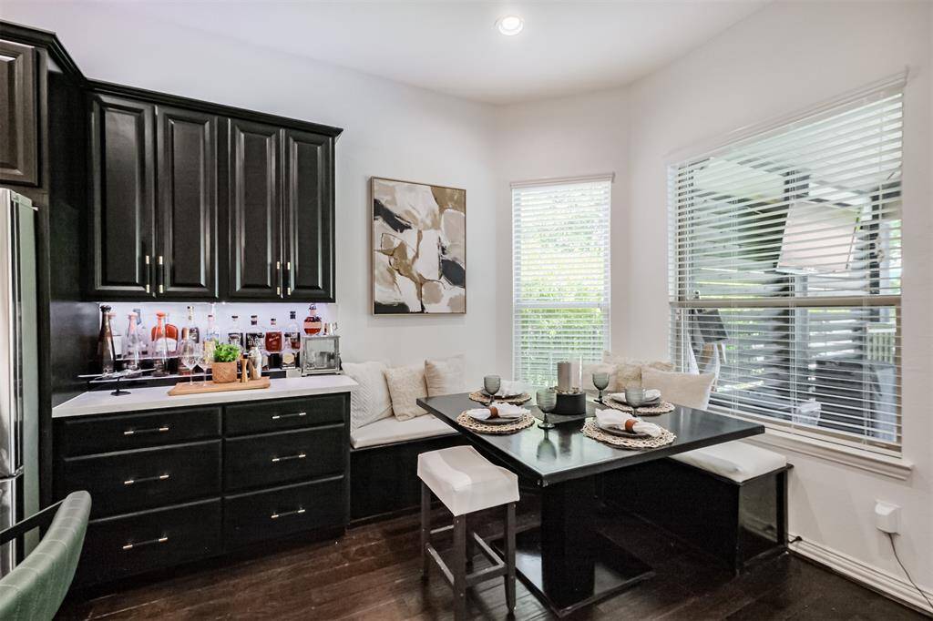 Great custom built corner bench with storage and dining table with view to the lake.