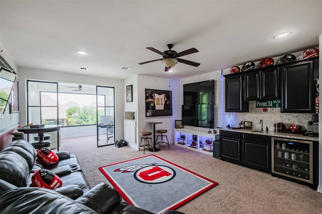 View of Game Room which leads to newly added Office/Study with views to the lake.