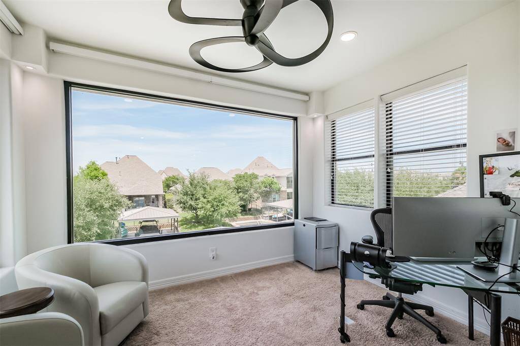 Picture yourself working at home in this Office/Study with windows on 3 sides affording 180 degree view of the lake.
