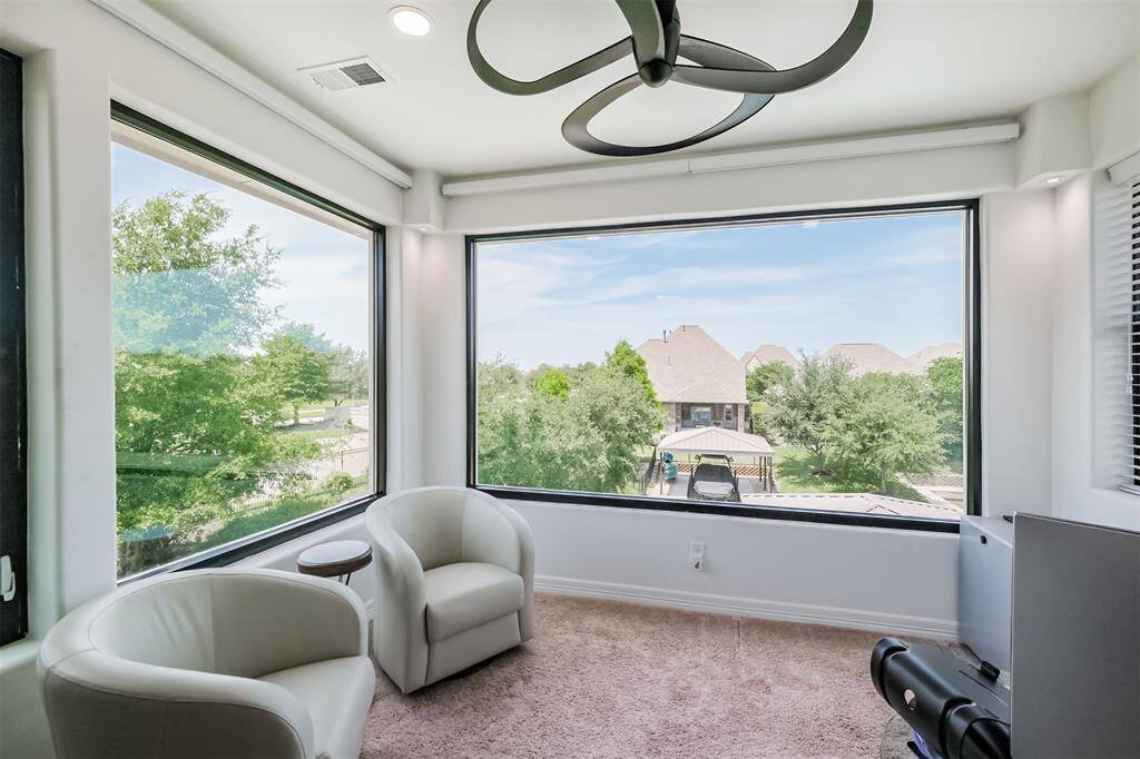 Windows have roll down shades for privacy and take a look at the beautiful ceiling fan.