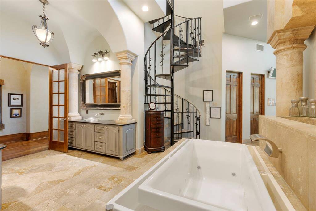 The stunning primary bath offers a true spa-like experience, designed for ultimate relaxation and luxury.