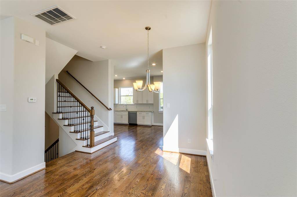LOOKING INTO DINING ROOM AND IN THE DISTANCE THE BREAKFAST ROOM AND SPACIOUS KITCHEN