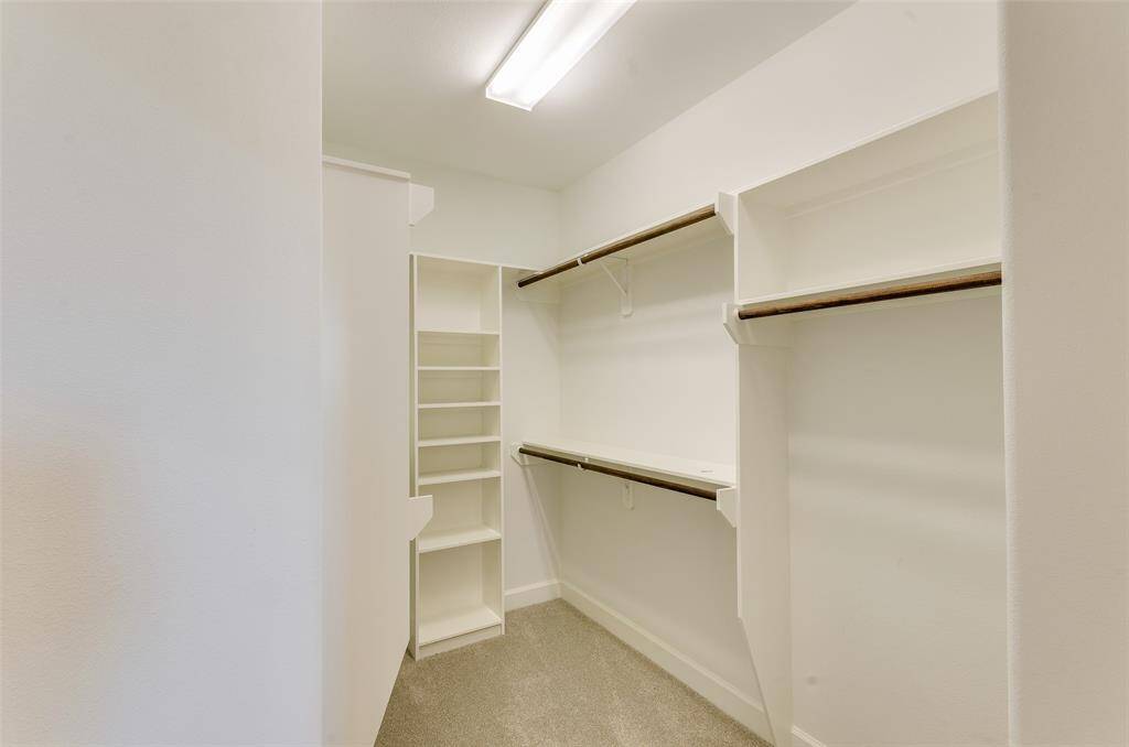 MASTER HAS 2 CLOSETS, THIS IS THE HERS CLOSET