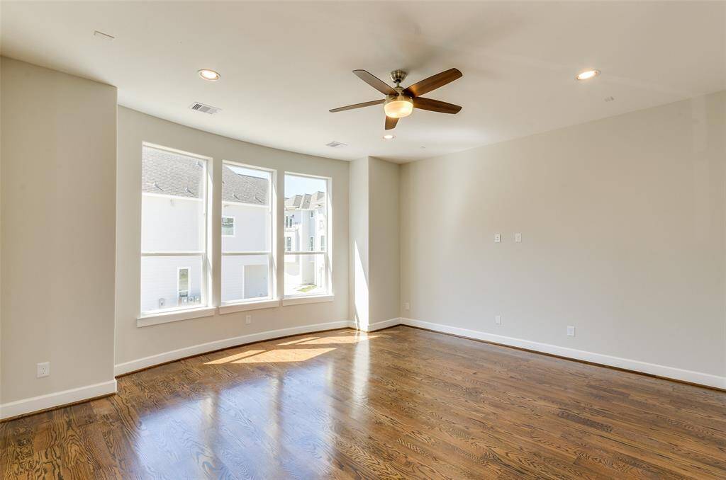 VIEW 3 OF LIVING ROOM OVERLOOKING THE PRIVATE STREET