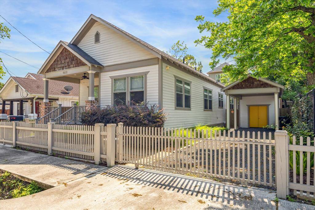 A gated driveaway and carport offer convenient off street parking.