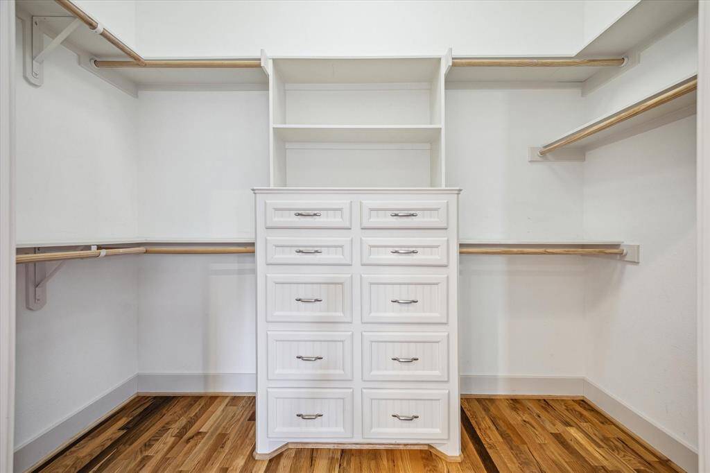 A spacious walk in closet in the primary bedroom is perfect for your wardrobe needs.