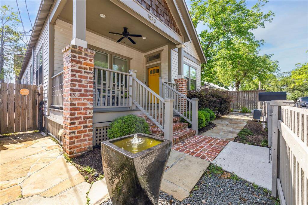 This welcoming front porch overlooks a small courtyard with a fountain. Enjoy your morning coffee or evening wine and greet the friendly neighbors!