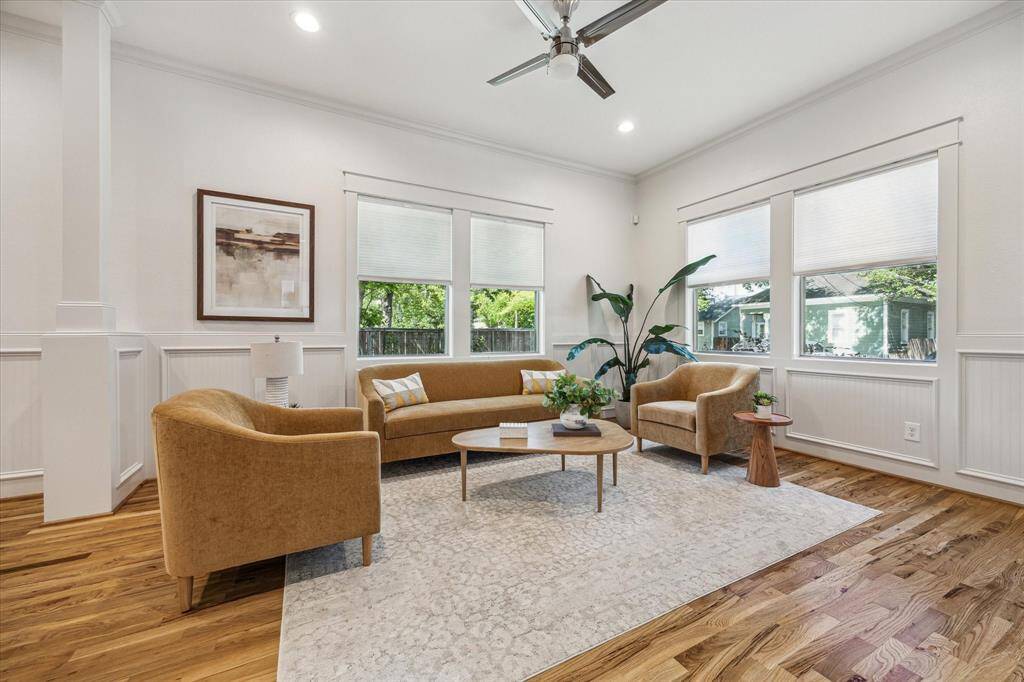 Welcome in! This inviting front room has abundant light, warm hardwood floors and plenty of space to relax and entertain