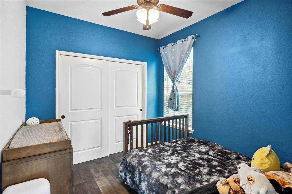 Fifth bedroom features awindow, custom paint, and plush carpet.