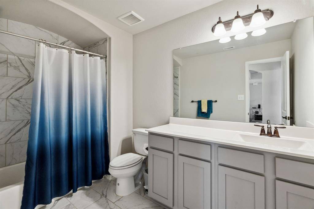 Third bathroom features atub/shower combo and long vanitywith plenty of counter space.