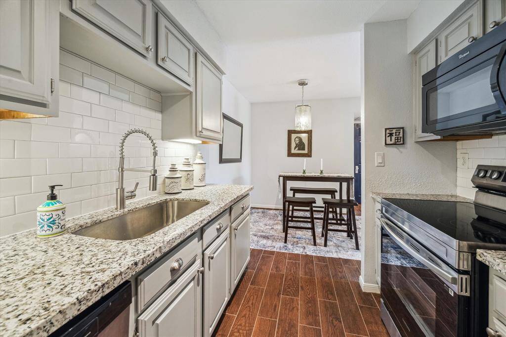 Whether you're trying out a new recipe or just reheating takeout from your favorite spot down the street, this fabulous kitchen has everything you need to cook, serve, and savor with ease.Enjoy ample countertop space for meal prep and cleanup, plenty of cabinetry and a built-in pantry for effortless storage, and sleek finishes including stainless steel appliances, granite countertops, and designer tile backsplash with under-cabinet lighting that adds just the right touch of flair.