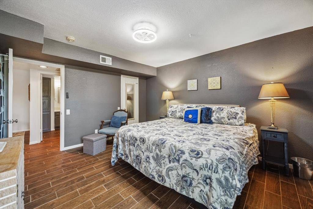 With ample space for your oversized furnishings and personal touches, create your own luxurious escape in this tranquil bedroom retreat. Thoughtful details like warm designer paint and durable wood-look tile flooring enhance the peaceful vibe, offer the perfect setting to rest and recharge.
