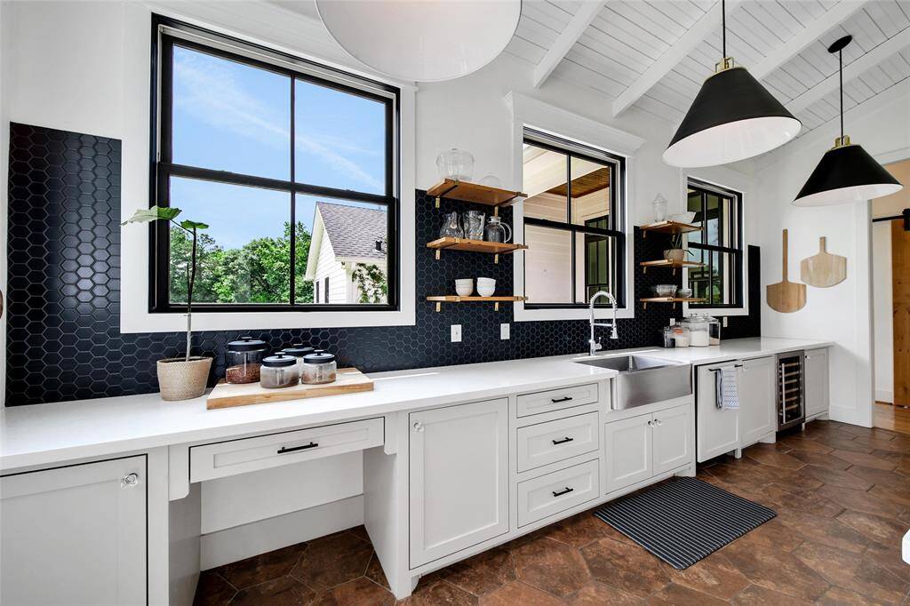 Full butler's pantry with built-in cabinets and sink