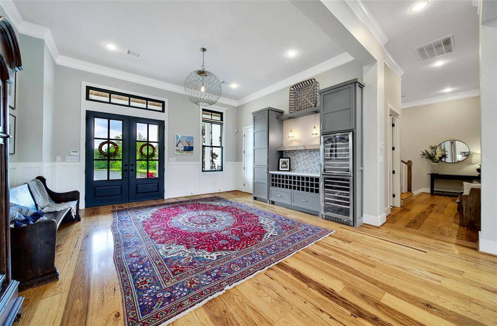 Formal entry with wine bar, complete with quartz counter and wine refrigerator