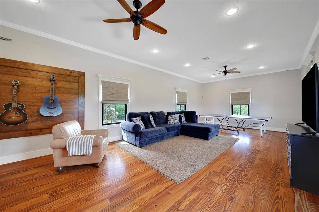Large upstairs game room with full bathroom and bonus room with walkout attic storage