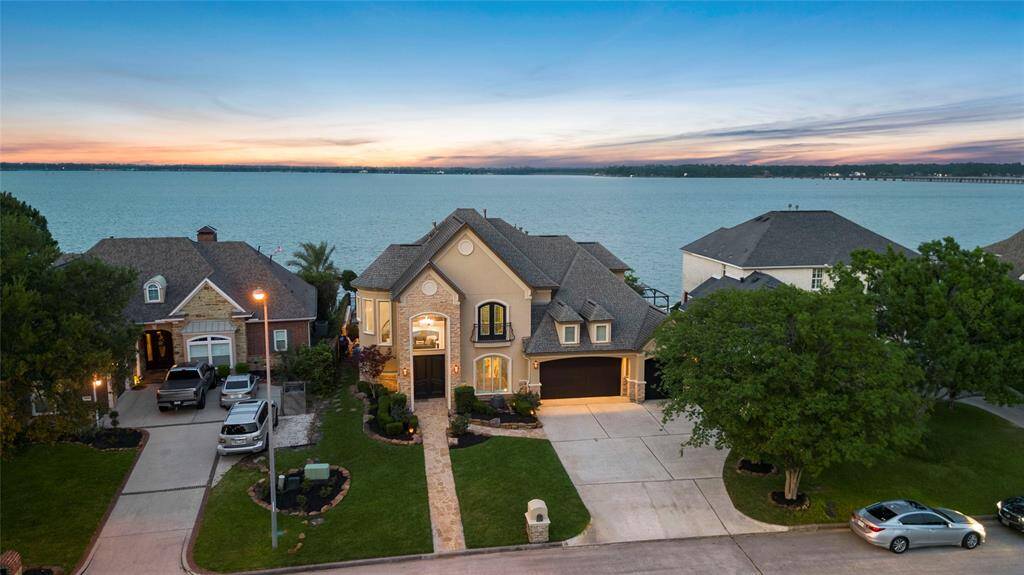 Welcome to 19007 Aquatic Drive: Custom Built on 75' of lakefront.