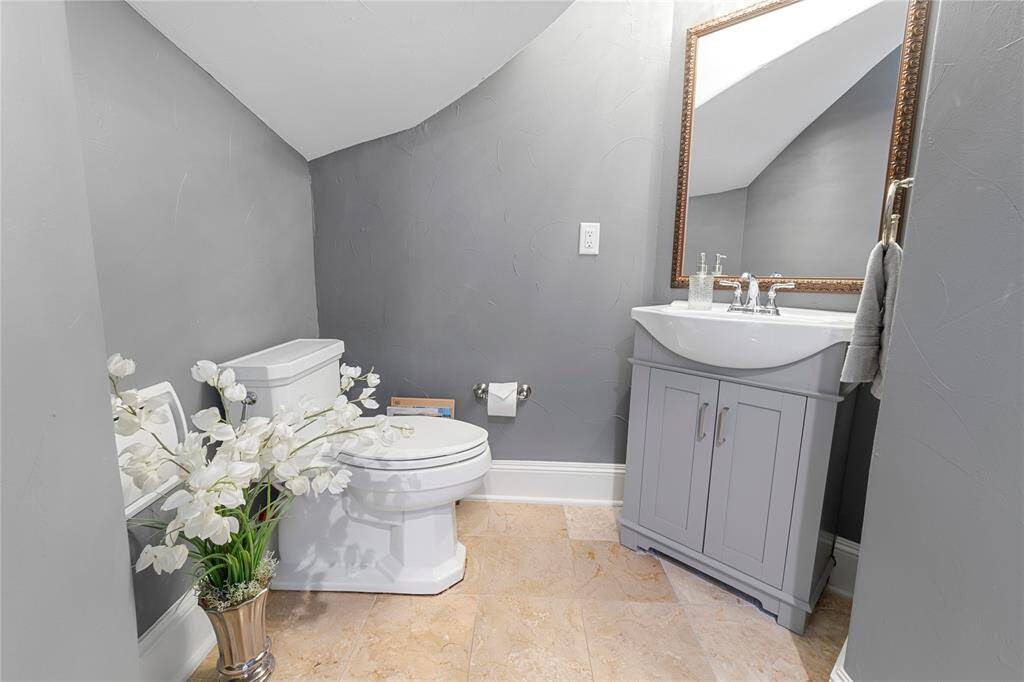Powder room underneath the stairs