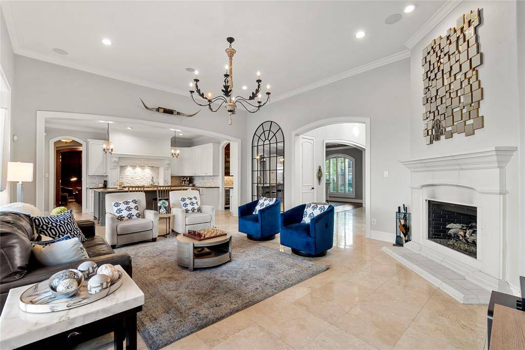 Open concept. No details left untouched.....cast fireplace, custom cabinets, gorgeous fixtures.