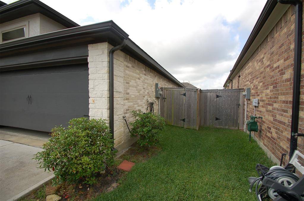 4 sides brick & gates on both sides of home.