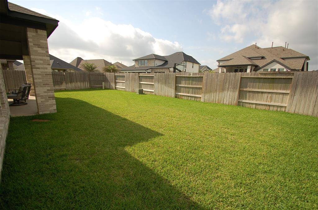 Back yard has plenty of room for children & pets
