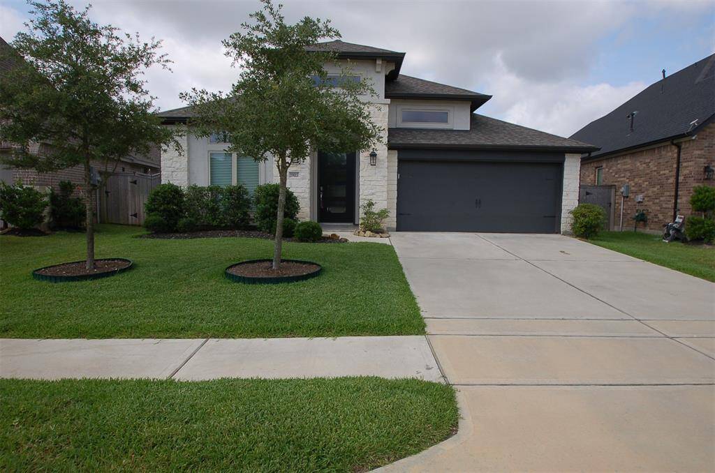 2 oak trees out front